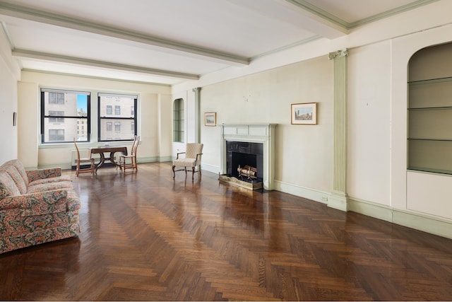 1165 Park Ave Unit 10A, New York City, NY 10128 - living room featuring a high end fireplace, beamed ceiling, baseboards, and arched walkways