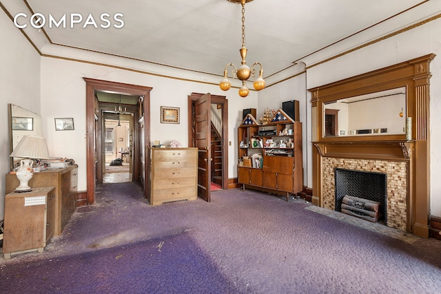 32 W 85th St, New York City, NY 10024 - carpeted living area featuring a chandelier, a fireplace with flush hearth, and ornamental molding