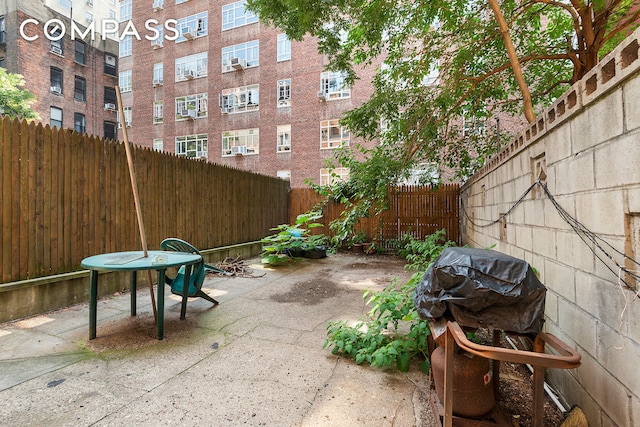 32 W 85th St, New York City, NY 10024 - fenced backyard featuring a patio and a grill