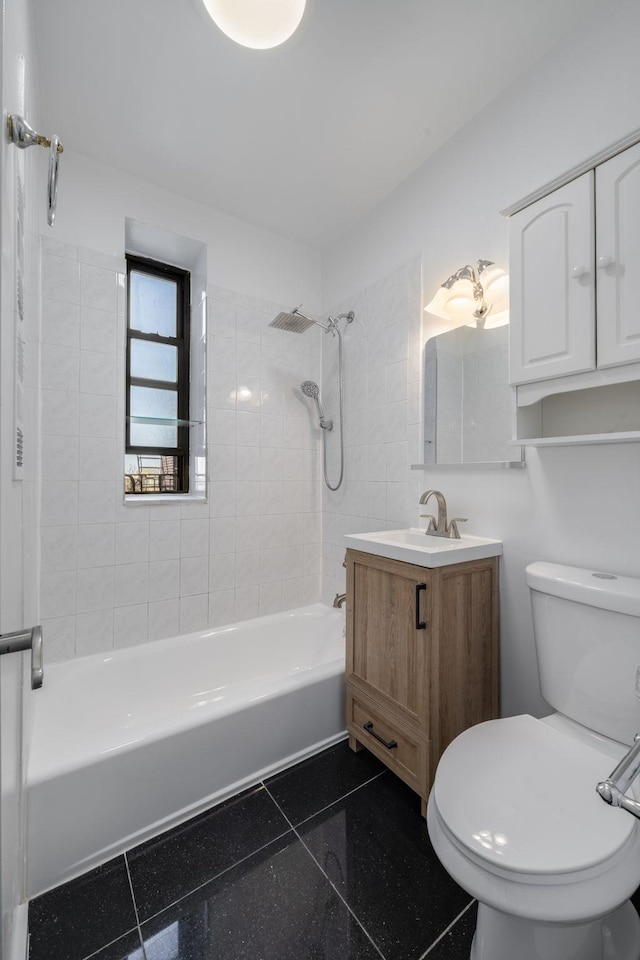 bathroom featuring vanity, shower / bathing tub combination, and toilet
