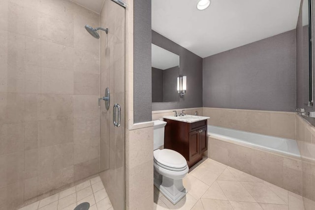 bathroom with vanity, tile patterned floors, a stall shower, and a bath