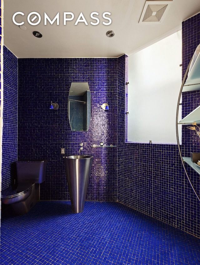 40 W 13th St Unit 2, New York City, NY 10011 - full bath with tile walls, toilet, and tile patterned floors