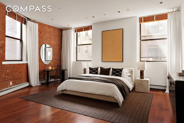 40 W 13th St Unit 2, New York City, NY 10011 - bedroom with brick wall, wood finished floors, and a baseboard radiator