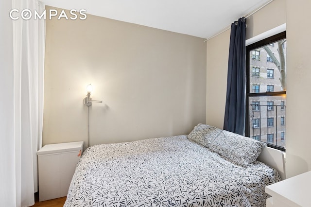 bedroom featuring wood finished floors