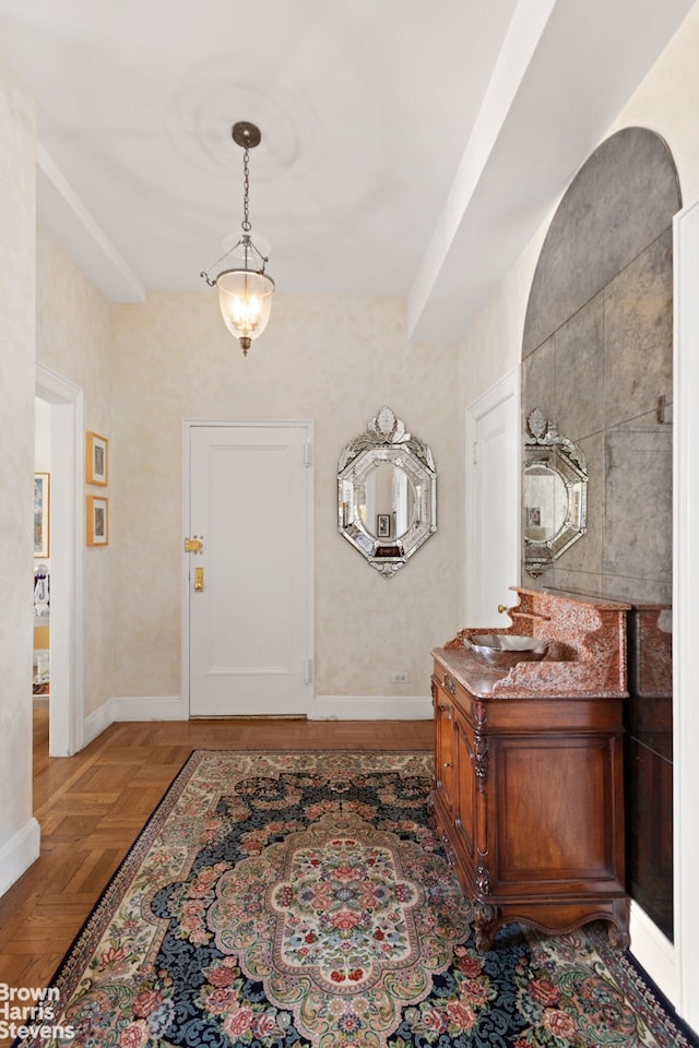 entryway featuring baseboards