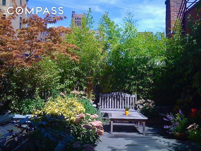 view of property's community with a patio