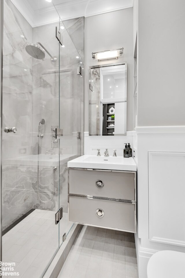 140 W 69th St Unit 812, New York City, NY 10023 - full bathroom featuring a shower stall, crown molding, and vanity