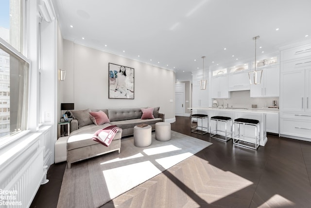 living room featuring dark wood-style flooring and recessed lighting