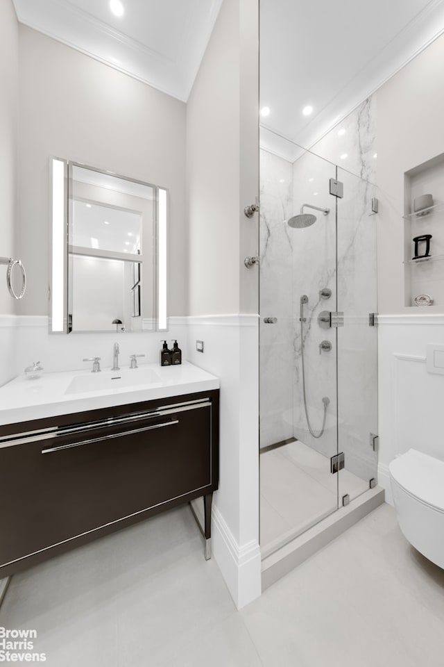 bathroom with a marble finish shower, ornamental molding, vanity, and toilet