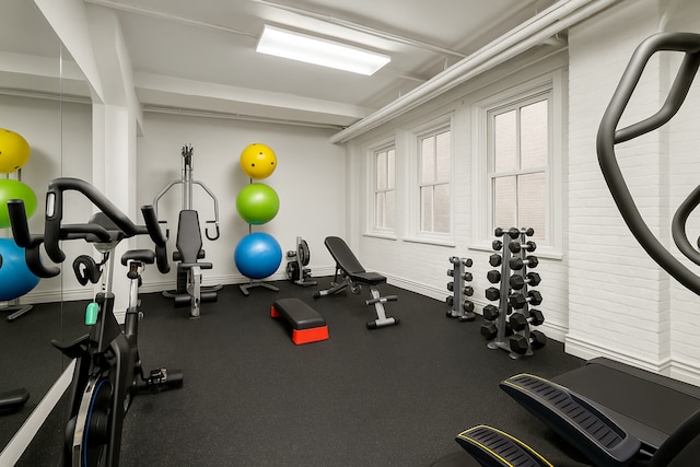 exercise room with baseboards
