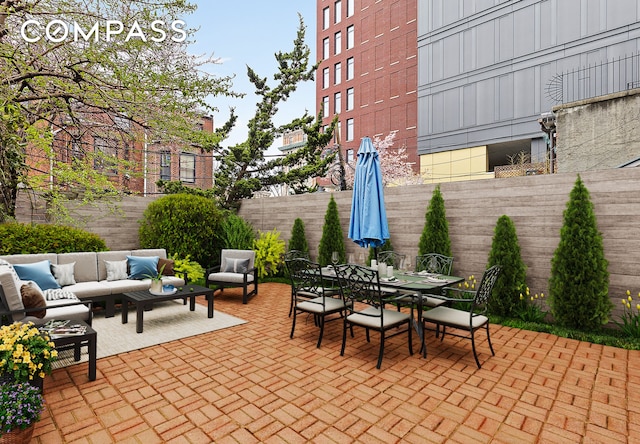 view of patio / terrace featuring a fenced backyard, outdoor dining area, and an outdoor living space