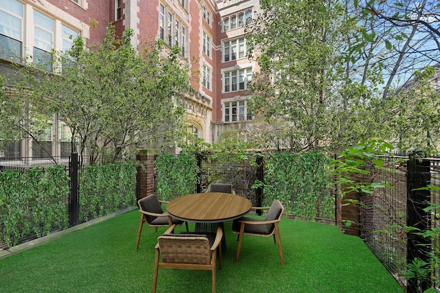 220 W 148th St Unit 1L, New York City, NY 10039 - fenced backyard featuring outdoor dining space