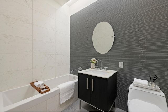 bathroom featuring a washtub, toilet, tile walls, and vanity