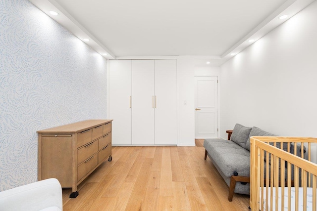 living area with recessed lighting, wallpapered walls, and light wood finished floors
