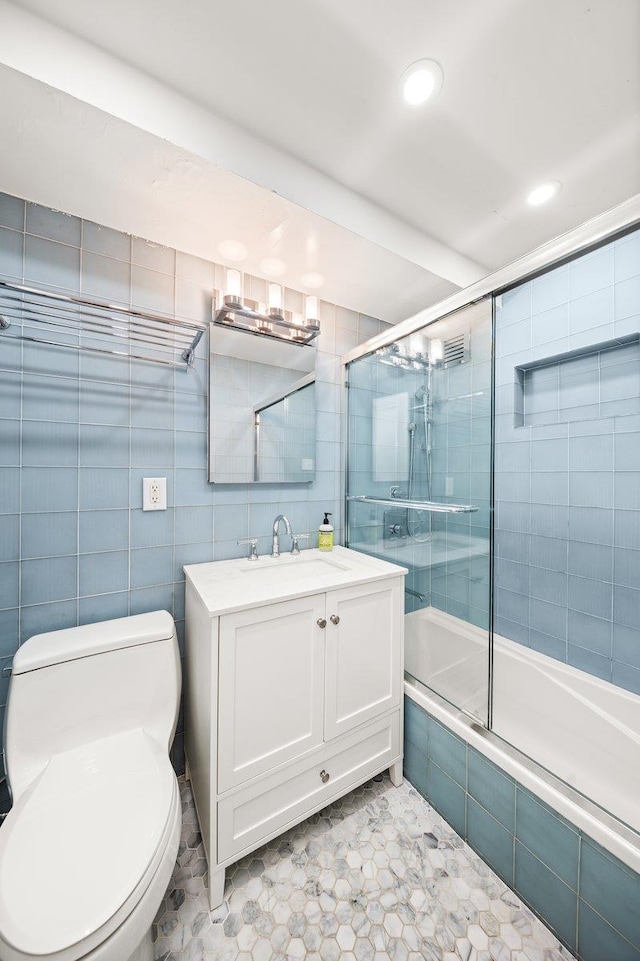 full bathroom featuring vanity, tiled shower / bath, tile patterned floors, toilet, and recessed lighting
