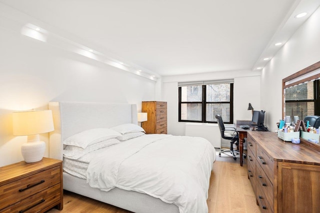 bedroom with recessed lighting and light wood finished floors