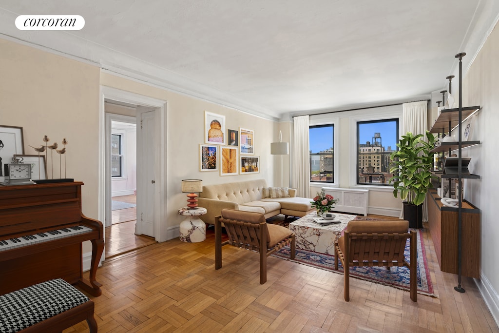 living room featuring crown molding and visible vents