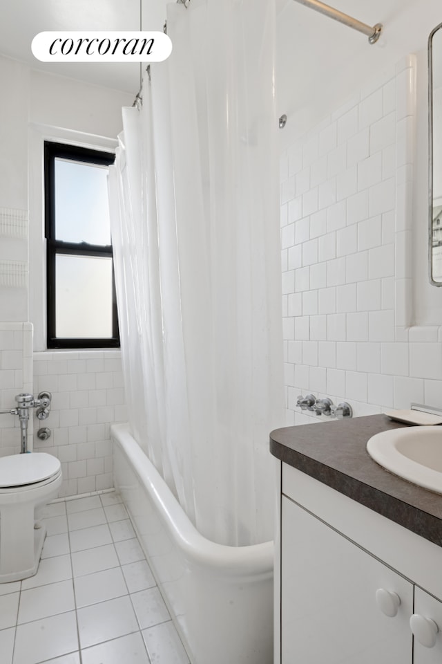 875 W End Ave Unit 12E, New York City, NY 10025 - full bath with tile walls, tile patterned floors, toilet, vanity, and shower / tub combo with curtain