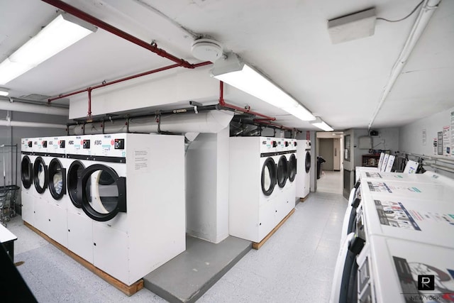 common laundry area with independent washer and dryer
