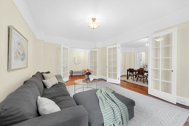 505 W End Ave Unit 2-B, New York City, NY 10024 - living area with wood finished floors, a chandelier, and french doors
