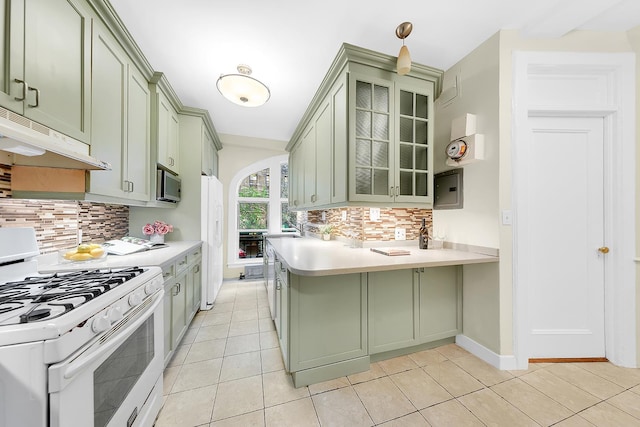505 W End Ave Unit 2-B, New York City, NY 10024 - kitchen with white appliances, green cabinetry, and under cabinet range hood