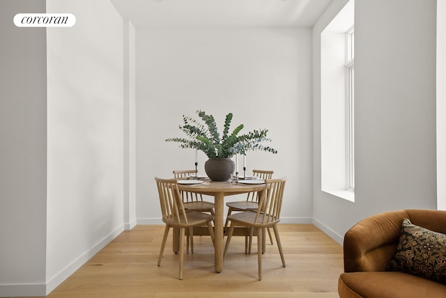 291 6th Ave Unit 4, New York City, NY 11215 - dining space featuring light wood-style flooring and baseboards