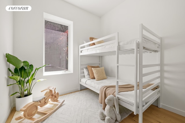 291 6th Ave Unit 4, New York City, NY 11215 - bedroom with baseboards and wood finished floors