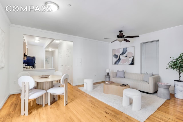 305 W 143rd St Unit 2, New York City, NY 10030 - living room featuring light wood-style flooring, ornamental molding, and a ceiling fan