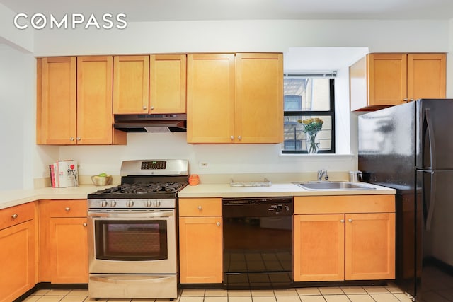 305 W 143rd St Unit 2, New York City, NY 10030 - kitchen with black appliances, under cabinet range hood, light countertops, and light tile patterned floors