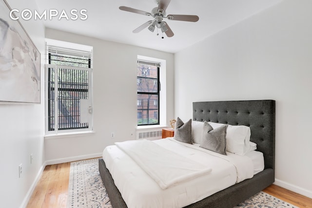 305 W 143rd St Unit 2, New York City, NY 10030 - bedroom with wood finished floors, radiator heating unit, and ceiling fan