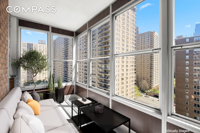 sunroom / solarium featuring a view of city