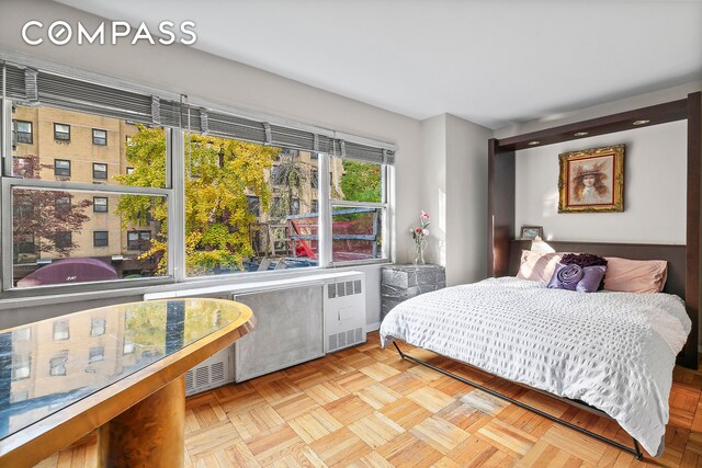 311 E 71st St Unit 2D, New York City, NY 10021 - bedroom featuring radiator