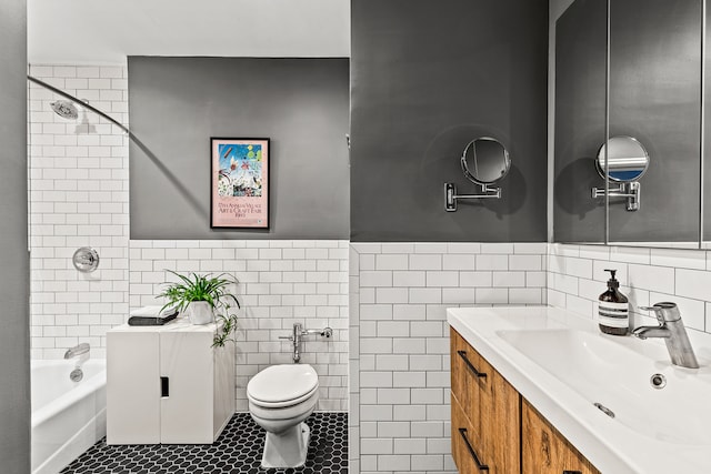 275 Webster Ave Unit 1J, New York City, NY 11230 - bathroom with tile walls, tile patterned floors, toilet, bathing tub / shower combination, and vanity