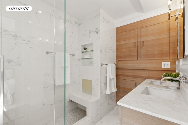 bathroom with a sink, a marble finish shower, double vanity, and marble finish floor