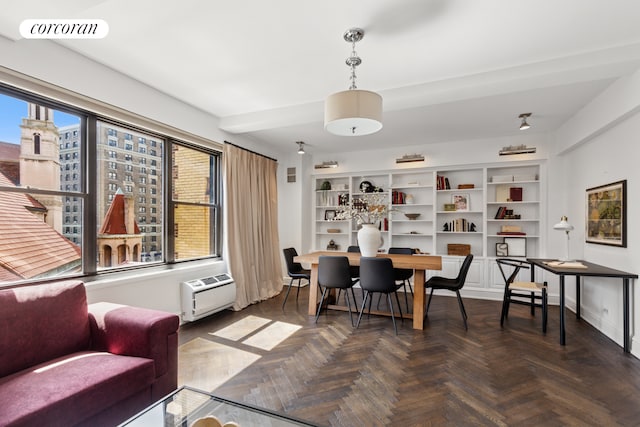 dining space featuring baseboards, visible vents, and a wall mounted air conditioner