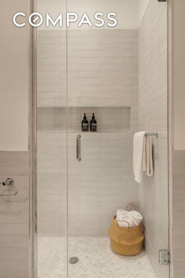 110 Livingston St Unit 6C, New York City, NY 11201 - bathroom featuring a shower stall and tile walls