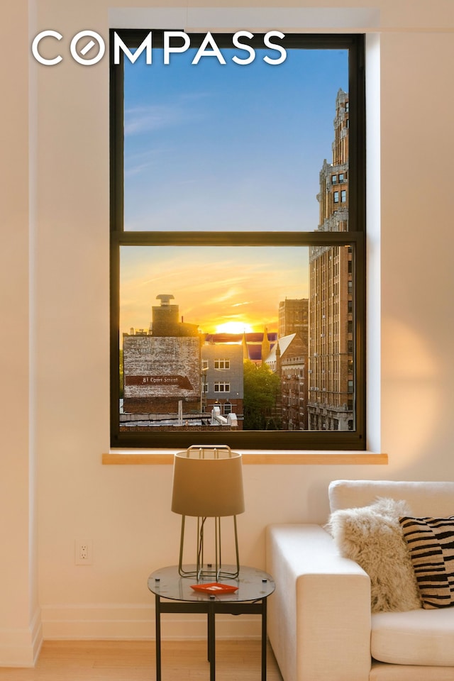 110 Livingston St Unit 6C, New York City, NY 11201 - sitting room featuring wood finished floors, baseboards, and a city view