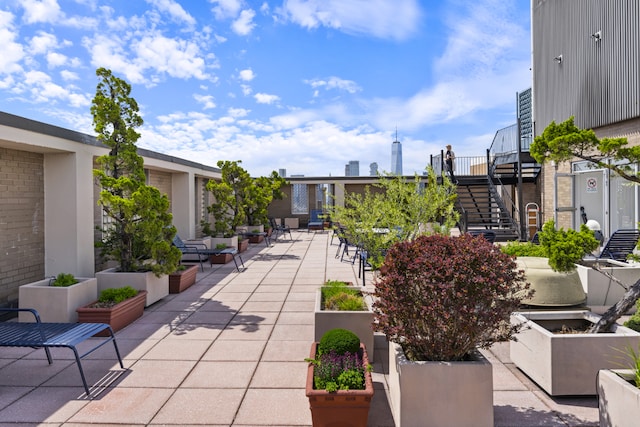 60 E 8th St Unit 11D, New York City, NY 10003 - view of community featuring stairway and a patio area