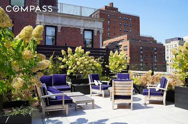 view of patio / terrace featuring an outdoor hangout area and a balcony