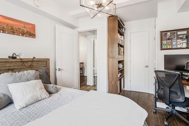 45 Tudor City Pl Unit 507, New York City, NY 10017 - bedroom featuring a chandelier, dark wood finished floors, and a desk