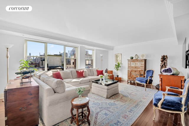 living area featuring crown molding, visible vents, and hardwood / wood-style flooring