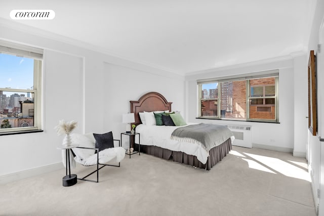 bedroom with carpet flooring, visible vents, ornamental molding, and multiple windows