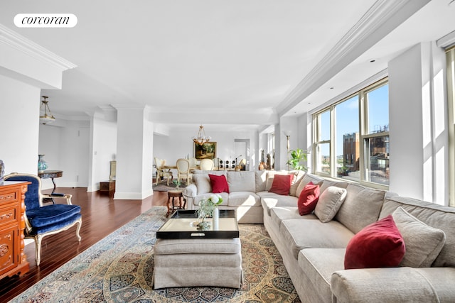 535 E 86th St Unit 21B, New York City, NY 10028 - living room featuring wood finished floors, crown molding, a chandelier, baseboards, and ornate columns