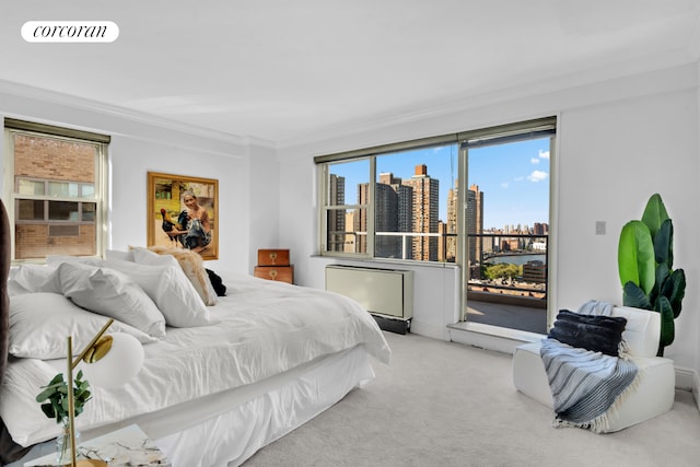 bedroom featuring ornamental molding, light carpet, a city view, and visible vents