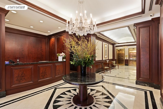 reception featuring visible vents and a notable chandelier