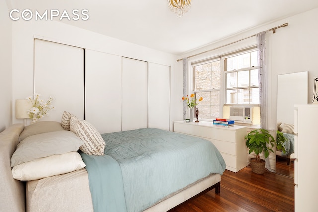 bedroom with a closet and wood finished floors