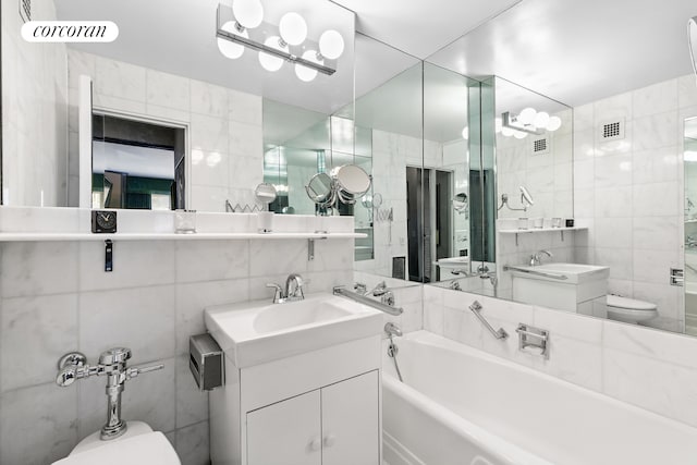 bathroom featuring visible vents, a sink, toilet, and tile walls