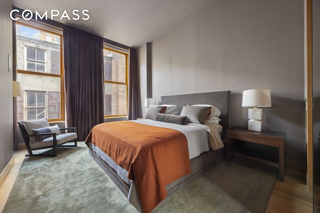 bedroom featuring wood finished floors
