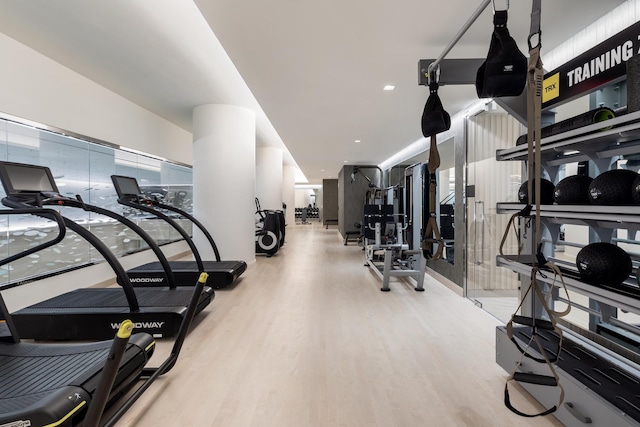 workout area with wood finished floors