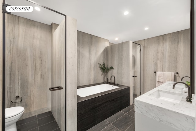 100 Barrow St Unit 5Cloft, New York City, NY 10014 - bathroom with toilet, a bath, recessed lighting, vanity, and tile patterned floors